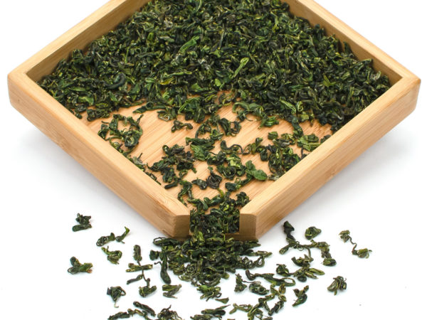 Late Harvest Mogan Green tea dry leaves in a wooden display box.