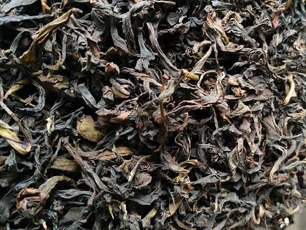 Charcoal Roasted Tieguanyin wulong dry tea leaves.