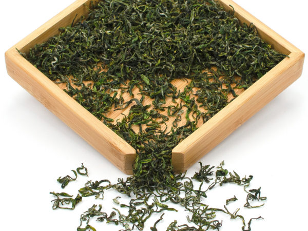 Yu Qian Mogan Green tea dry leaves in a wooden display box.